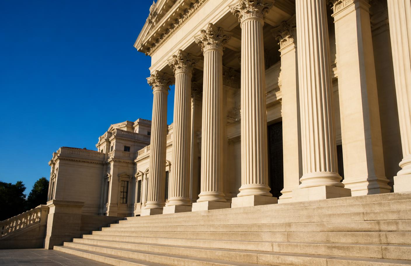 Steps and colonnade of a courthouse in morning light